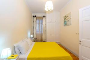 A bed or beds in a room at Ampio Cantone Suite