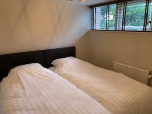 Tempat tidur dalam kamar di Achterhoekse vakantiewoning, infraroodsauna, geweldig uitzicht, goede bedden