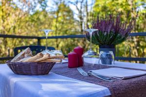 a picnic table with a basket of bread on it at La Tagliolina in Monteveglio