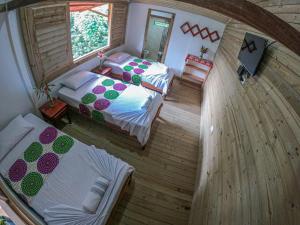 En eller flere senge i et værelse på Cabaña Villa Sofi