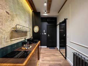 Kuchyňa alebo kuchynka v ubytovaní Stylowy apartament Wabi Sabi z Smart tv