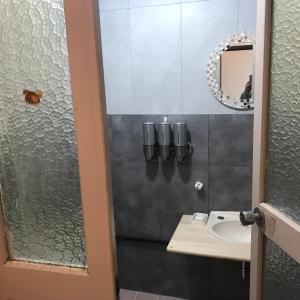 a bathroom with a sink and a mirror at 山下ビル307 in Kurosakimachi