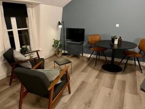TV a/nebo společenská místnost v ubytování Hotel de Gaaper