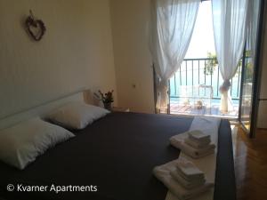 Postel nebo postele na pokoji v ubytování Kvarner Apartments II - Mošćenička Draga