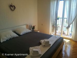 Postel nebo postele na pokoji v ubytování Kvarner Apartments II - Mošćenička Draga