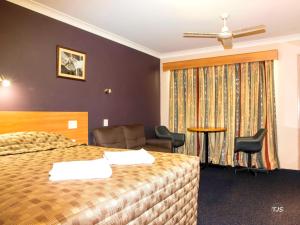 Postel nebo postele na pokoji v ubytování SunPalms Motel + 24 fotografií