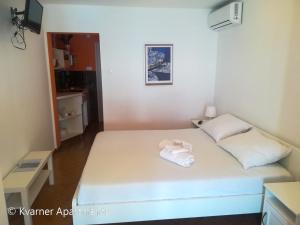 Postel nebo postele na pokoji v ubytování Kvarner Apartments II - Mošćenička Draga