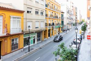 a car driving down a city street with buildings at Apartamento Vicky Victoria in Málaga