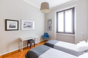 Posteľ alebo postele v izbe v ubytovaní Spacious and brilliant apartment in Duomo by Easylife