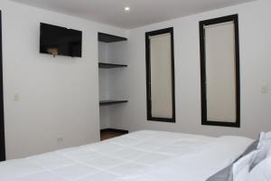 Postel nebo postele na pokoji v ubytování Hotel Dorado Plaza Bogota