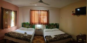 Łóżko lub łóżka w pokoju w obiekcie Casona del Negro Aguilar