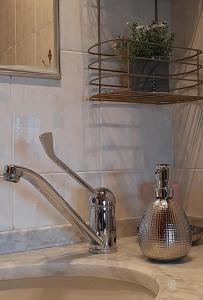 a bathroom sink with a faucet on a counter at Casa Ester in Torre Dei Corsari