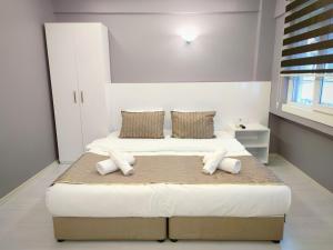 Кровать или кровати в номере Olen Altunizade Hotel