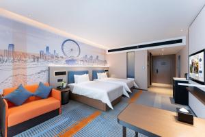 Letto o letti in una camera di Hampton by Hilton Guangzhou Jinshazhou