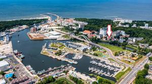 an aerial view of a harbor with a marina at Villa Kapitańska in Kołobrzeg