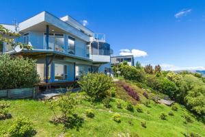 an image of a house on a hill at Tasman Bay Villa in Nelson