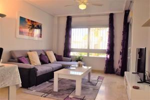 a living room with a couch and a table at FABULOUS 2 BED 2 BATH APARTMENT ! in Villamartin