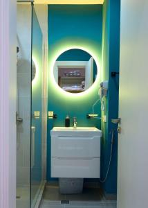 a bathroom with a sink and a mirror at Victoria's Panoramic View, ALPIC in Gudauri