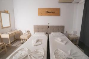Postel nebo postele na pokoji v ubytování Κastro Ηotel