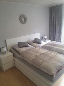 מיטה או מיטות בחדר ב-Ferienhaus Käthe
