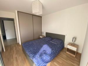 Postel nebo postele na pokoji v ubytování Appartement à quelques minutes du lac d’Annecy - Saint-Jorioz + 5 fotografií