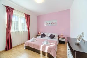 Posteľ alebo postele v izbe v ubytovaní Villa Ankora