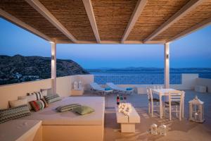 a living room with a view of the ocean at Astoria Hotel in Agia Galini