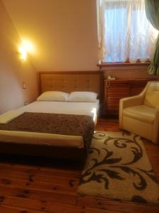 En eller flere senge i et værelse på Gostiniy Dvor Non-Stop