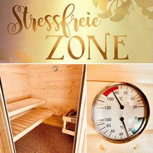 a sauna with a clock and a sign that reads stressfire zone at Ferienhaus Traumzeit in NeuhÃ¼tten