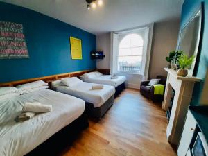 Postel nebo postele na pokoji v ubytování KX Rooms Kings Cross