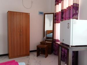 Kuchyň nebo kuchyňský kout v ubytování Pearl Holiday Inn