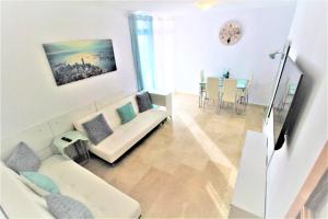 Televízia a/alebo spoločenská miestnosť v ubytovaní Residence Vacanza Torre Montecarlo