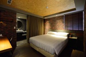 Postel nebo postele na pokoji v ubytování City Suites - Kaohsiung Pier2