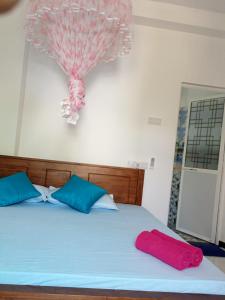 Postel nebo postele na pokoji v ubytování Pearl Holiday Inn