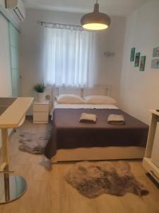 Postel nebo postele na pokoji v ubytování Miriam Rooms Zadar