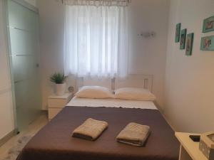 Postel nebo postele na pokoji v ubytování Miriam Rooms Zadar