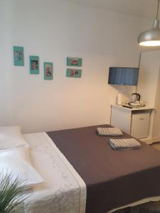 Postel nebo postele na pokoji v ubytování Miriam Rooms Zadar