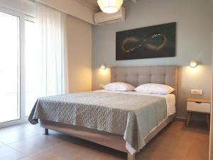 Un pat sau paturi într-o cameră la Tamaris Homes