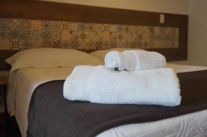 Cama ou camas em um quarto em Pousada Solar Das Gerais