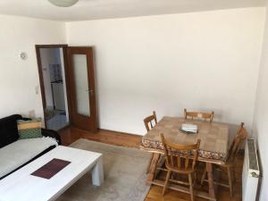 a room with a table and chairs and a bed at Apartment in Sarajevo