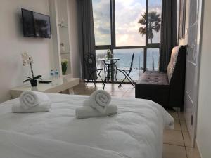 Ліжко або ліжка в номері Sea Line Hotel From R&A Group