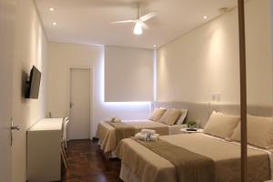 Voodi või voodid majutusasutuse Novo Hotel Iguaçu toas