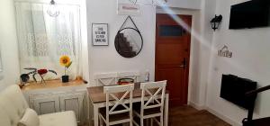 a kitchen with a table and chairs in a room at Casa iulia in Haro