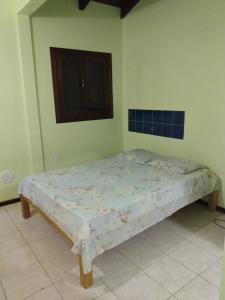 Cama ou camas em um quarto em Condominio Aldeia da Praia