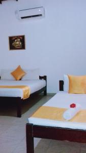 Tempat tidur dalam kamar di Villa DeLorenta
