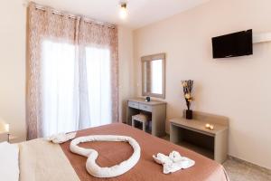 TV a/nebo společenská místnost v ubytování Sueño beach hotel
