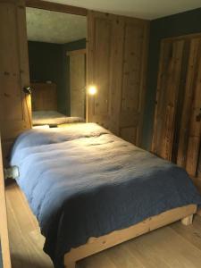 a bedroom with a large bed in a room at Domaine de Malpas in Villers-le-Lac