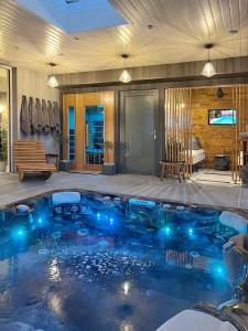 a swimming pool with blue lights in a house at The Hideaway Retreat in Omagh