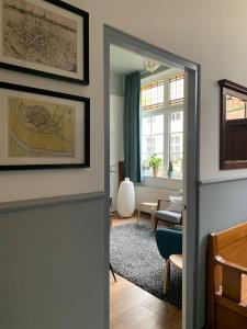 a living room with a door leading into a living room at Het Rode Pakhuis in Doesburg