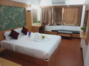 Ένα ή περισσότερα κρεβάτια σε δωμάτιο στο Hotel Kewal